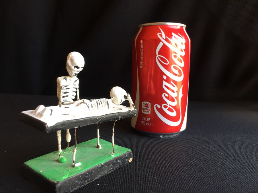 Skeleton Operating On Skeleton Figure [Photo 1]