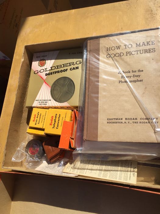 Box Of Vintage Camera Equipment And Books