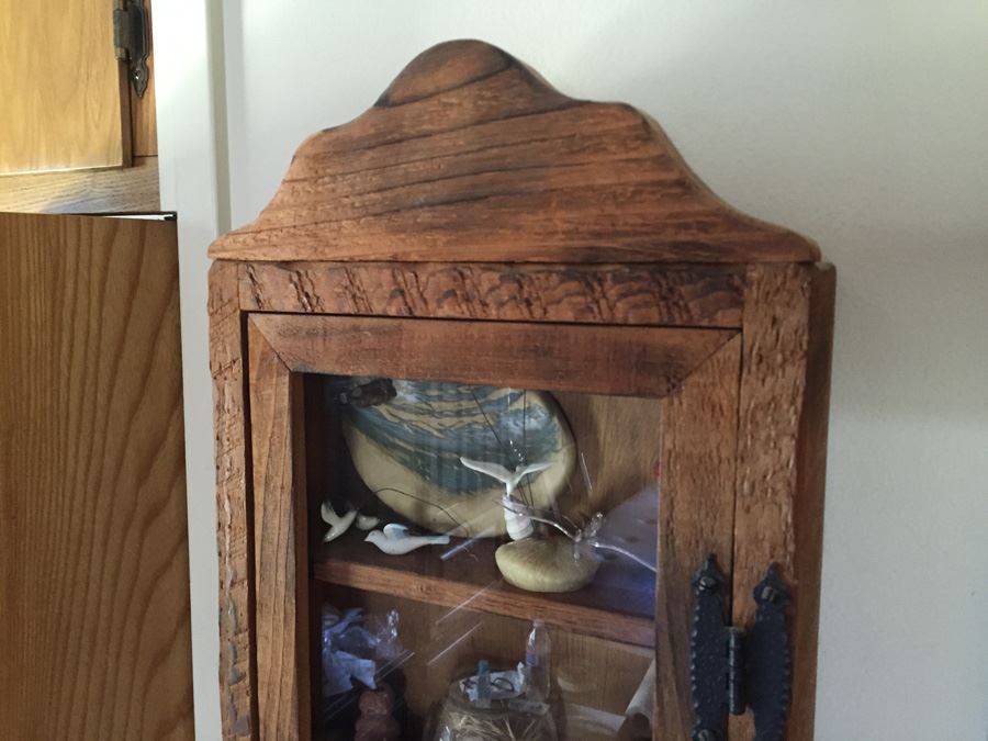 Wall Mounted Cabinet With Items [Photo 5]