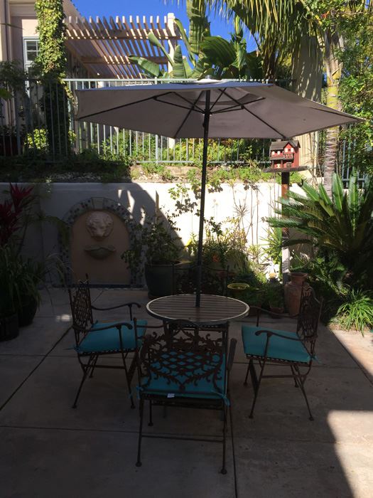 Outdoor Patio Table With Four Chairs And Umbrella [Photo 7]
