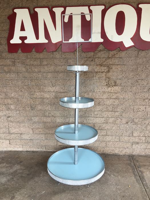 Store Display Fixture With Round Tiered Jeweled Shelves And Sign Mount On Top