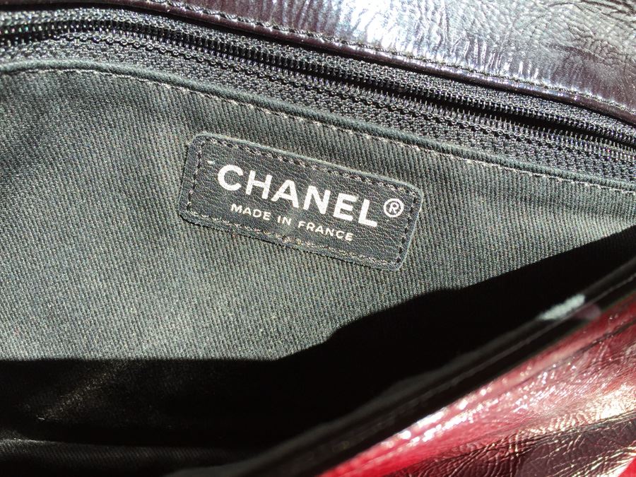 Black Chanel Handbag With Gold Hardware And Chain [Photo 8]