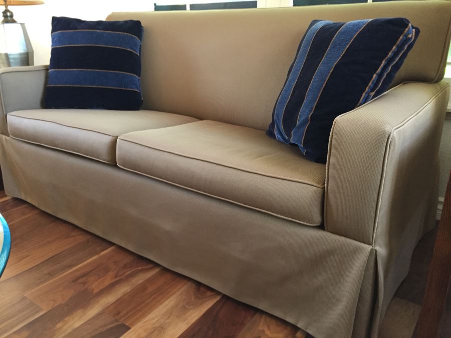Clean Tan Sofa With Modern Lines And Two Pillows In Excellent Condition [Photo 2]