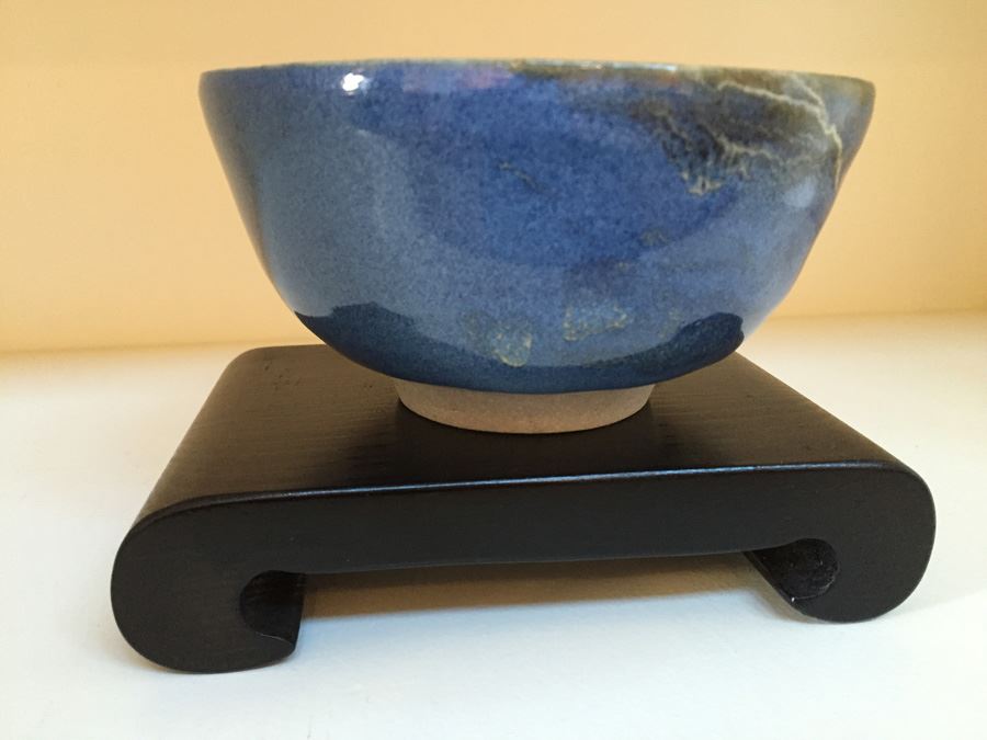Six Inch Blue Glazed Pottery On Wooden Stand