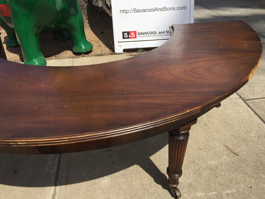 Mid-Century Semi-Circular Coffee Table On Casters Estimate $100-$200 [Photo 7]