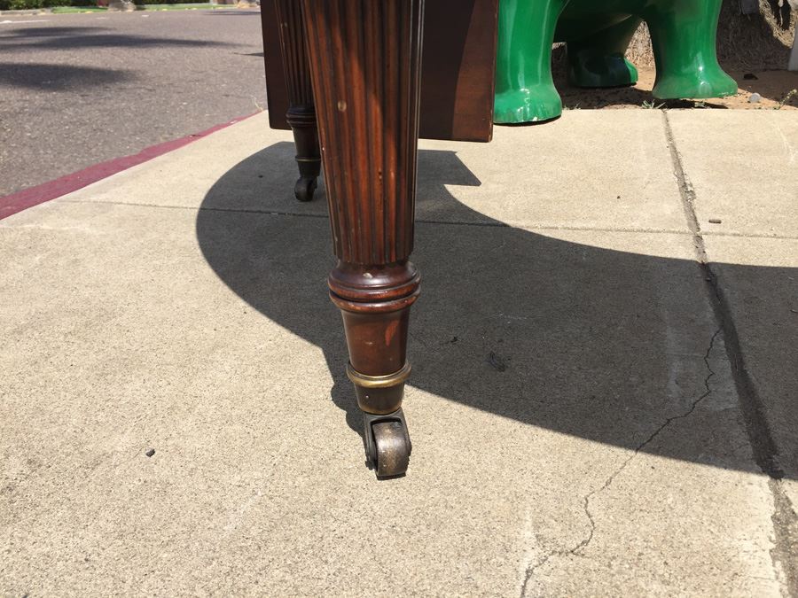 Mid-Century Semi-Circular Coffee Table On Casters Estimate $100-$200 [Photo 5]