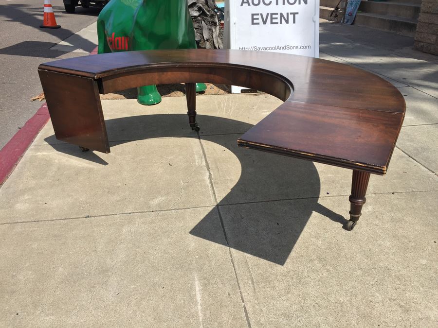 Mid-Century Semi-Circular Coffee Table On Casters Estimate $100-$200 [Photo 10]
