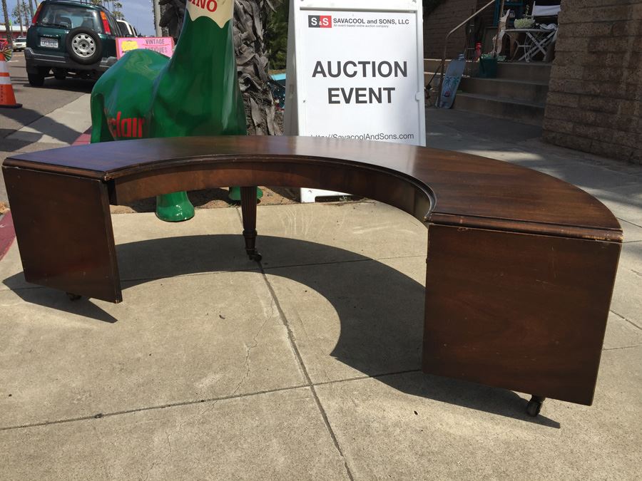 Mid-Century Semi-Circular Coffee Table On Casters Estimate $100-$200 [Photo 2]