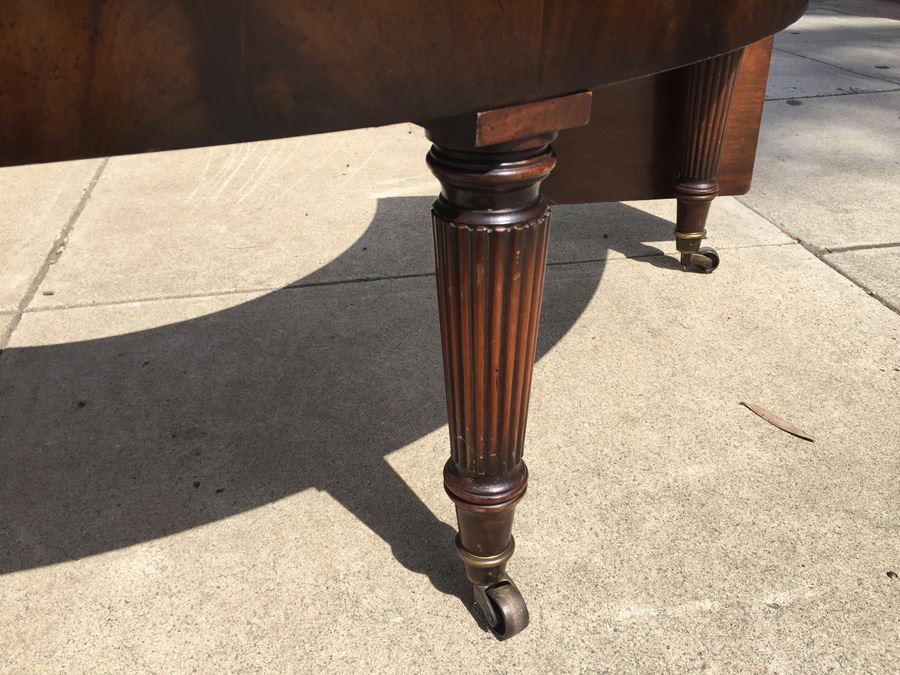 Mid-Century Semi-Circular Coffee Table On Casters Estimate $100-$200 [Photo 8]