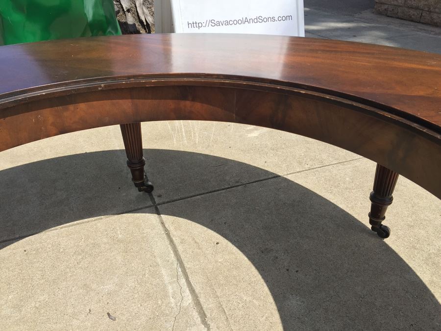 Mid-Century Semi-Circular Coffee Table On Casters Estimate $100-$200 [Photo 12]