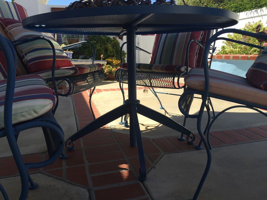 Vintage Blue Heavy Wrought Iron Patio Table With Four Chairs And Blue Umbrella