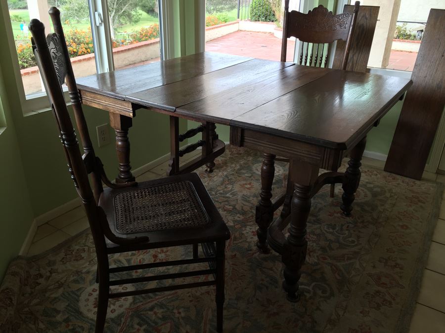 Antique Oak Dining Table With Four Leaves And Two Cane Chairs [Photo 1]