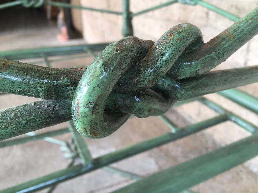 Large Wrought Iron Arm Chair With Rope And Knot Patterns And White Cushions [Photo 11]