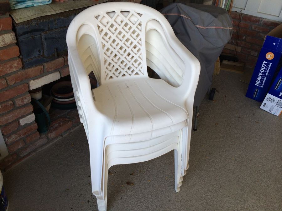 Stacking White Plastic Chairs [Photo 1]