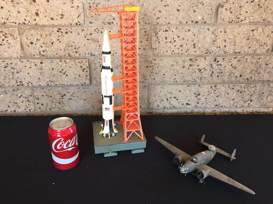 Vintage Rocket On Launch Pad And Aircraft