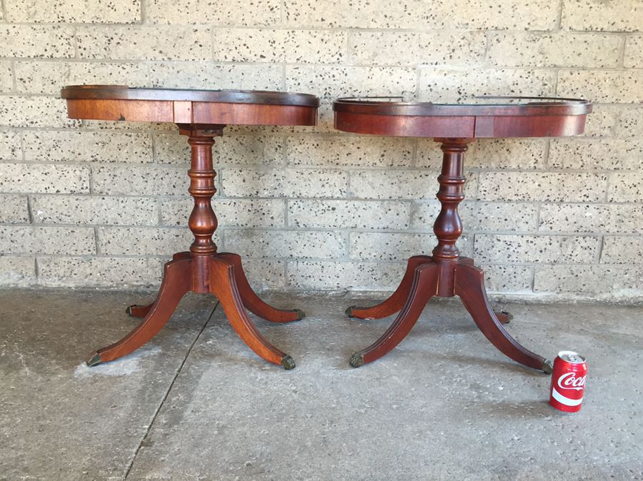 Pair Of Oval Top 4 Leg Tables With Protective Glass Tops And Brass Claw Feet
