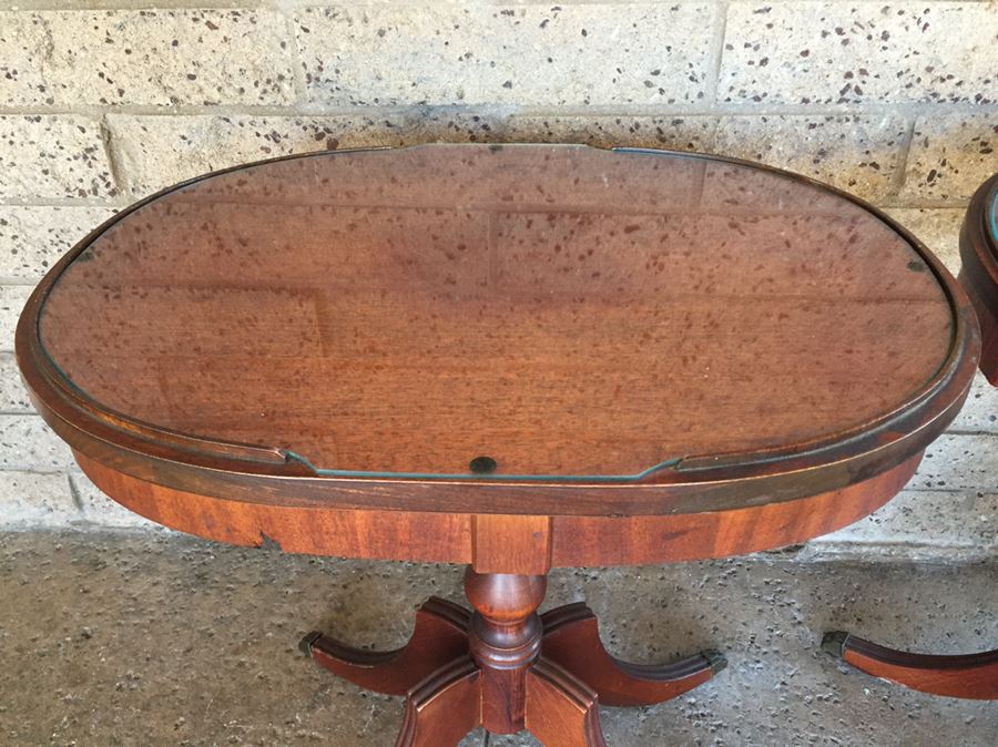 Pair Of Oval Top 4 Leg Tables With Protective Glass Tops And Brass Claw Feet [Photo 2]