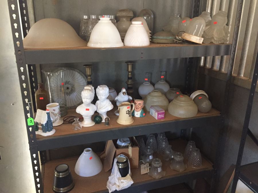 Metal Cabinet With Glass Light Shades And Figurines Includes Metal Shelving [Photo 1]