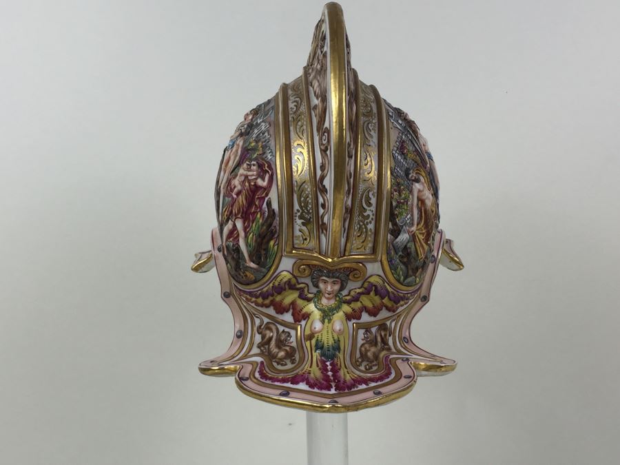 Stunning Capo Di Monte Porcelain Renaissance-Style Helmet With Lucite Display Stand Relief Molding With Scenes Of Griffins Estimate $1,200 [Photo 24]