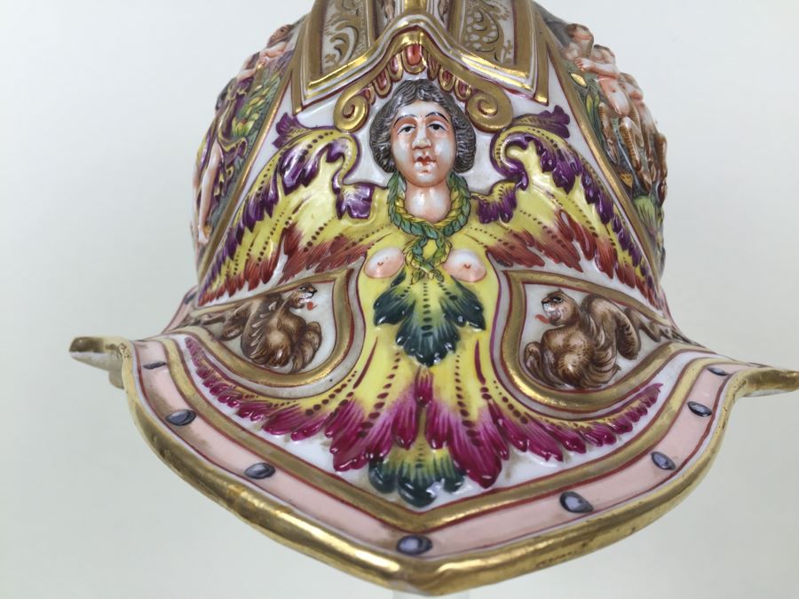 Stunning Capo Di Monte Porcelain Renaissance-Style Helmet With Lucite Display Stand Relief Molding With Scenes Of Griffins Estimate $1,200 [Photo 14]