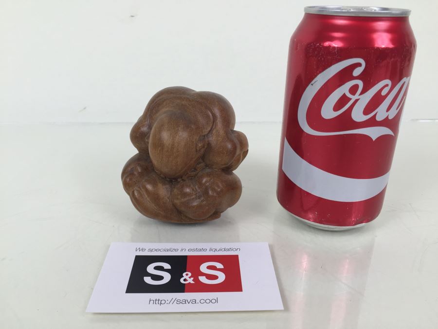 Carved Wood Figure Of Man Hiding His Head [Photo 1]