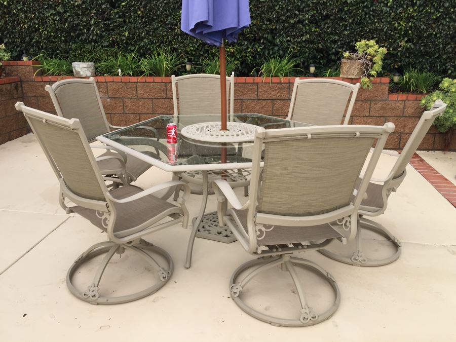 Outdoor Patio Table With Six Swivel Chairs And Umbrella