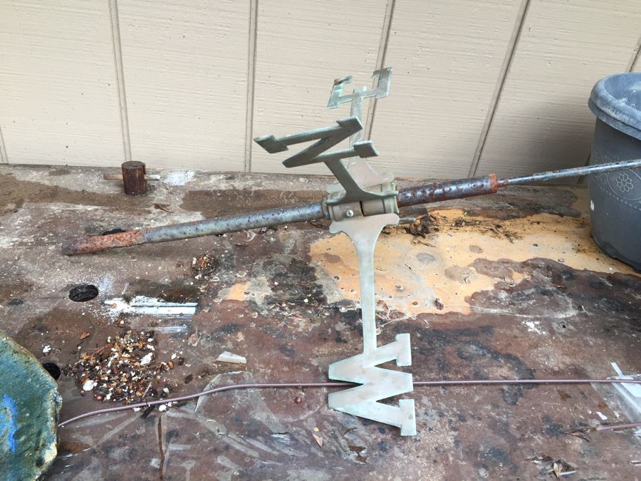 Outdoor Garden Table With Blue English Bench Vice, Various Pots And Partial Weather Vane [Photo 9]