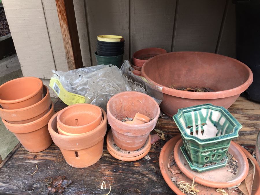 Outdoor Garden Table With Blue English Bench Vice, Various Pots And Partial Weather Vane [Photo 6]