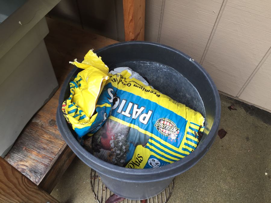 Outdoor Garden Table With Blue English Bench Vice, Various Pots And Partial Weather Vane [Photo 19]