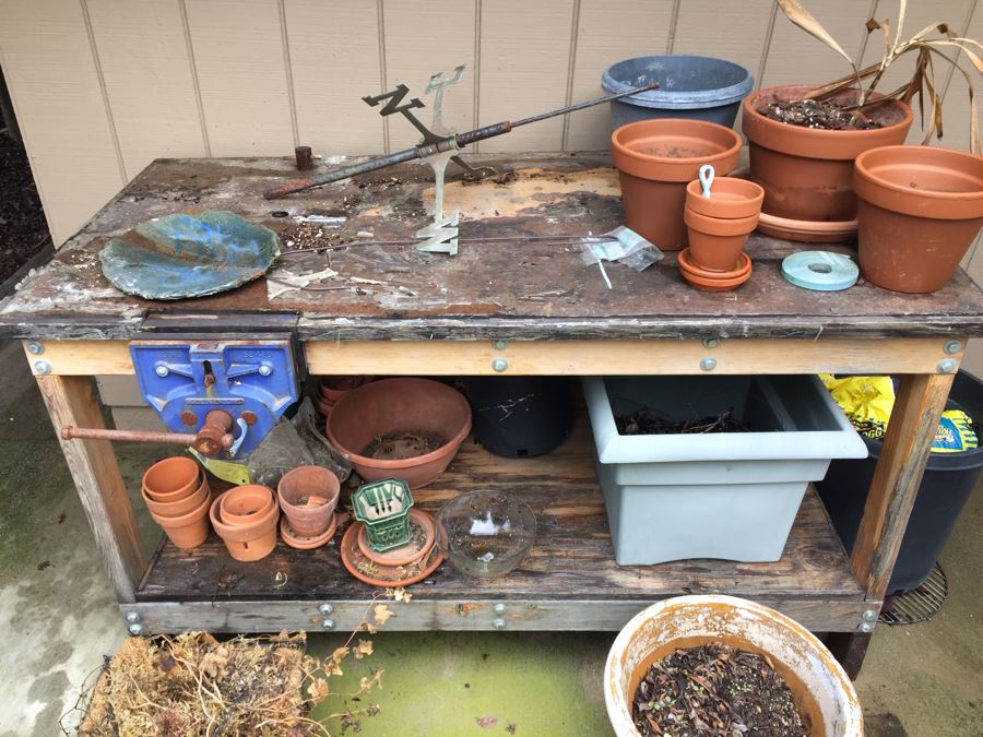 Outdoor Garden Table With Blue English Bench Vice, Various Pots And Partial Weather Vane [Photo 4]