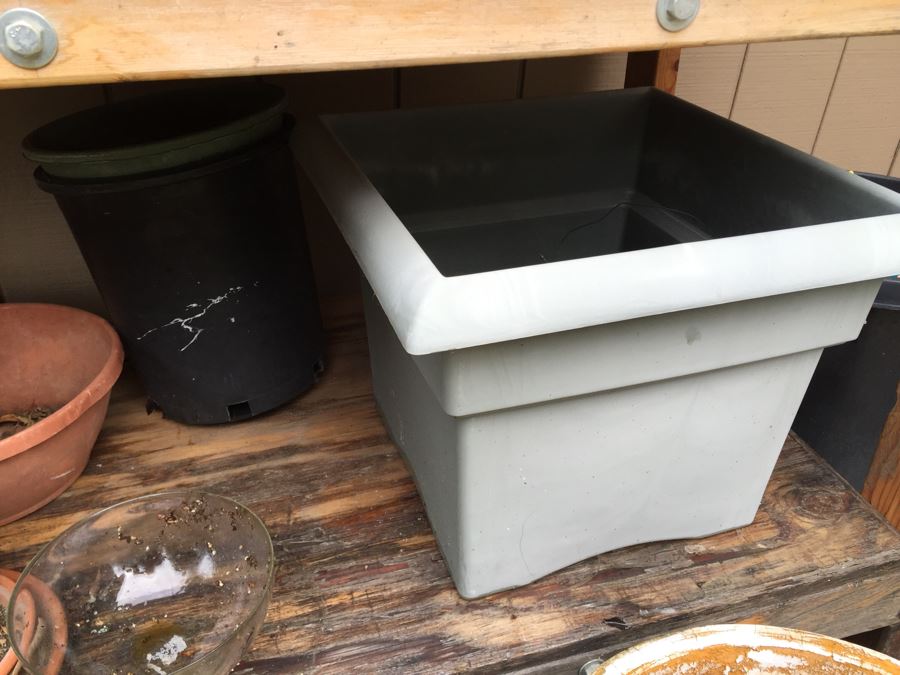 Outdoor Garden Table With Blue English Bench Vice, Various Pots And Partial Weather Vane [Photo 7]
