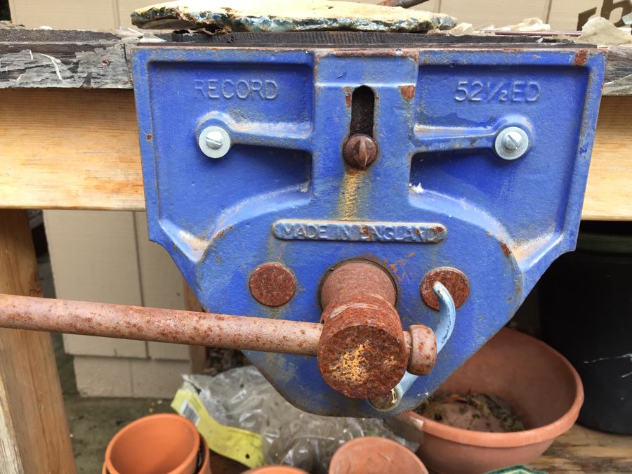 Outdoor Garden Table With Blue English Bench Vice, Various Pots And Partial Weather Vane [Photo 2]
