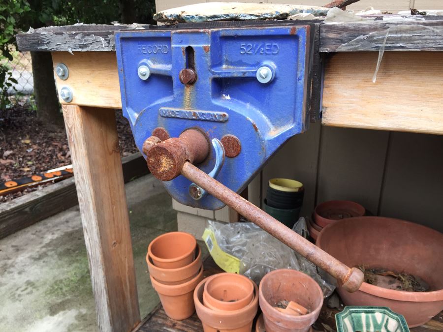 Outdoor Garden Table With Blue English Bench Vice, Various Pots And Partial Weather Vane [Photo 18]