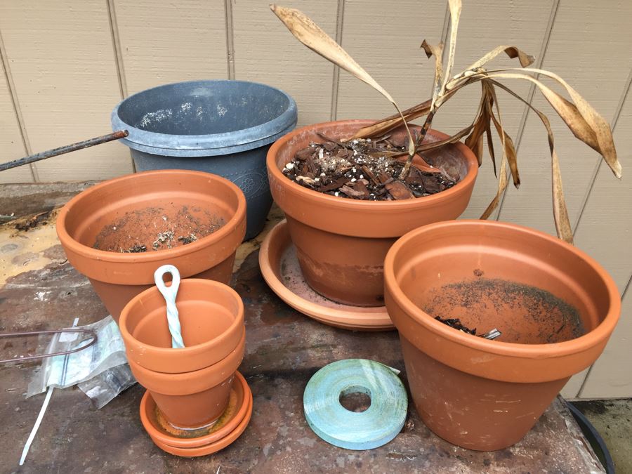 Outdoor Garden Table With Blue English Bench Vice, Various Pots And Partial Weather Vane [Photo 8]