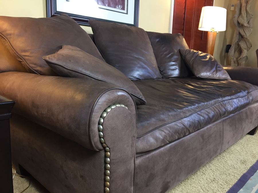 leather sofa with brass studs