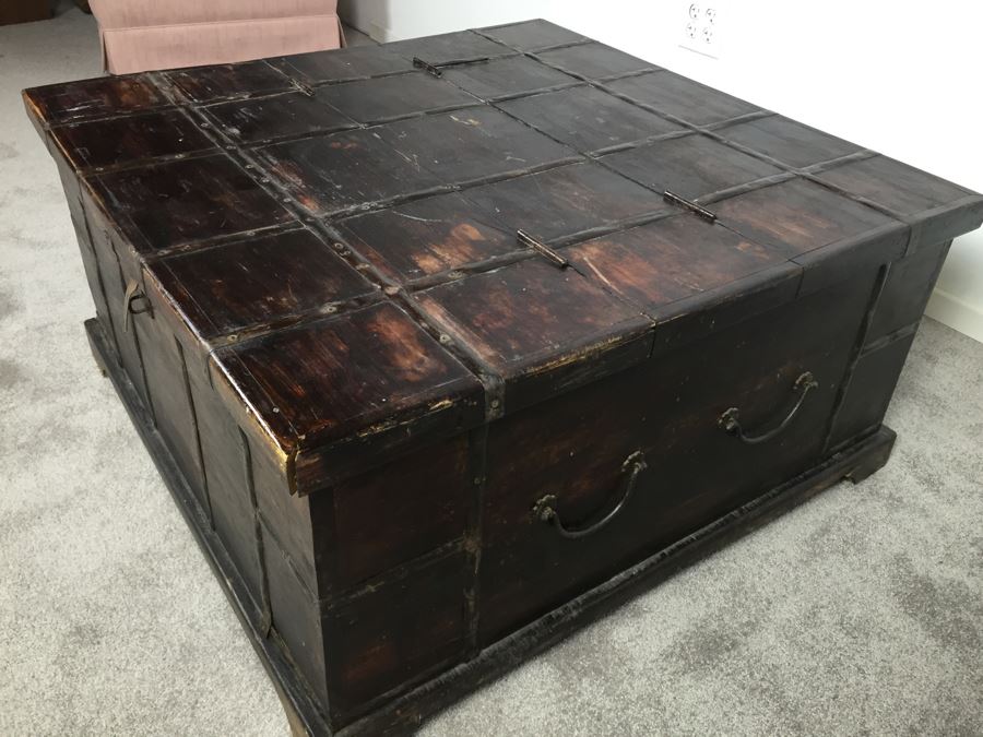 Rustic Wooden Coffee Table With Metal Accents And Hinged Top For Storage [Photo 1]