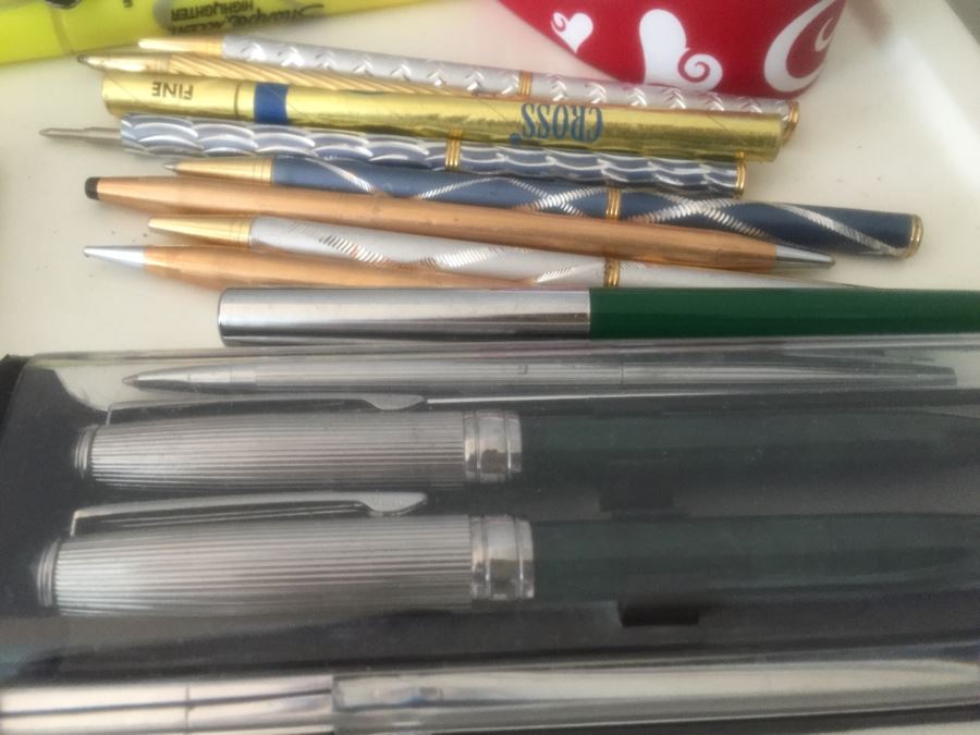 Rolling Plastic Storage Bin Filled With Office Supplies Including Pens [Photo 2]