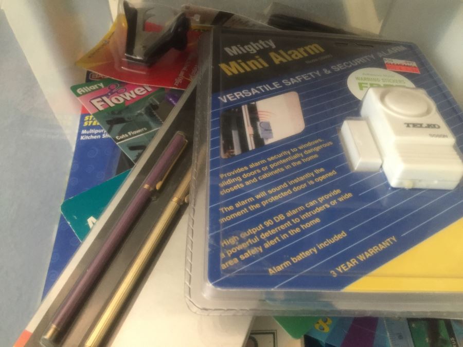 Rolling Plastic Storage Bin Filled With Office Supplies Including Pens [Photo 11]