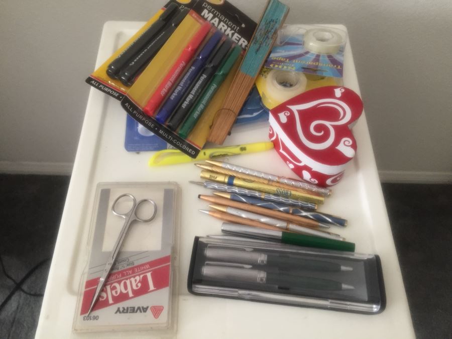 Rolling Plastic Storage Bin Filled With Office Supplies Including Pens [Photo 4]