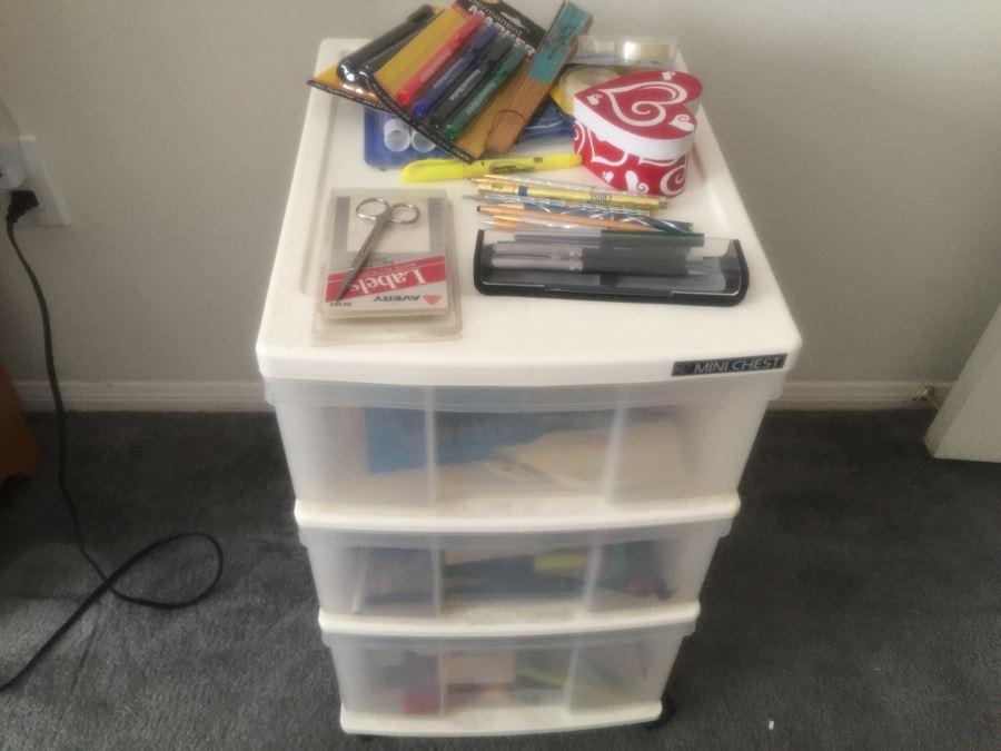 Rolling Plastic Storage Bin Filled With Office Supplies Including Pens [Photo 1]