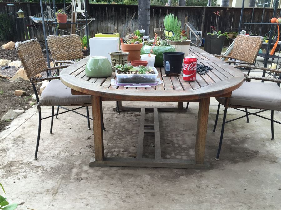 Large Outdoor Teak Table With 4 Chairs Filled With Potted Succulents