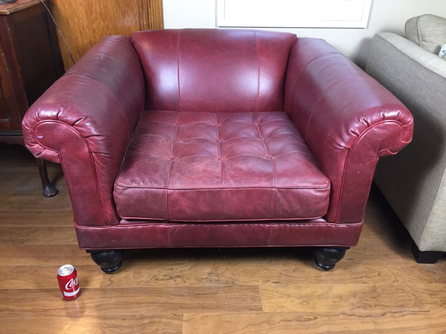 Burgundy Leather Armchair With Leather Throw Pillows [Photo 1]