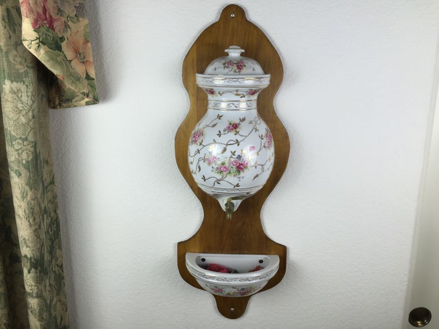 Vintage Lavabo Porcelain Wall Fountain Water Tank And Basin With Gilt Floral Motif And Brass Spigot Mounted To A Wood Plaque