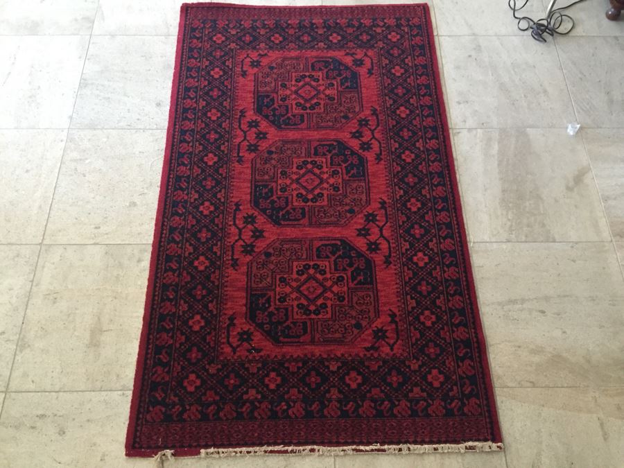 Red And Black Rug With Geometric Patterns