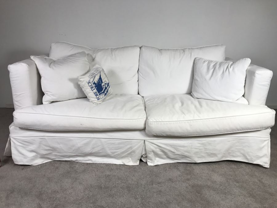 Sofa Sleeper With White Slip Cover [Photo 1]