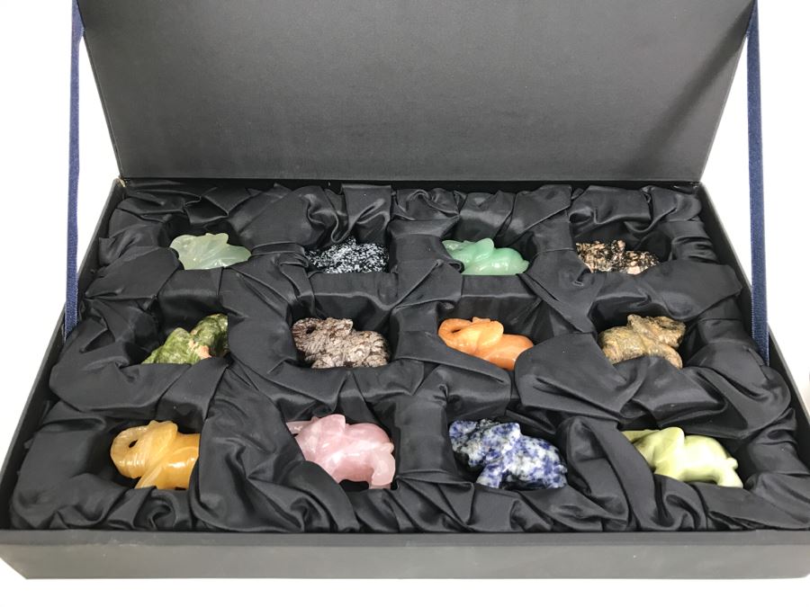 Display Box Filled With 12 Carved Elephants Made From Various Stones Including New Jade, Butter Jade, Brazilian Sodalite And More