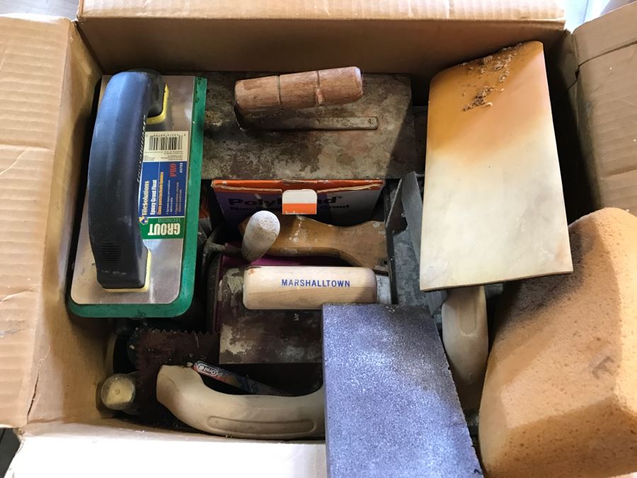 Box Filled With Tile Cement Tools