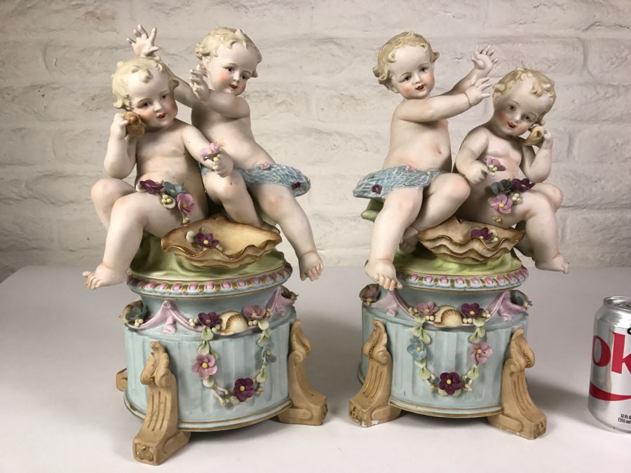 Pair Of Large Hand Painted Figures Of Young Boys On Pedestal Signed Underneath [Photo 1]