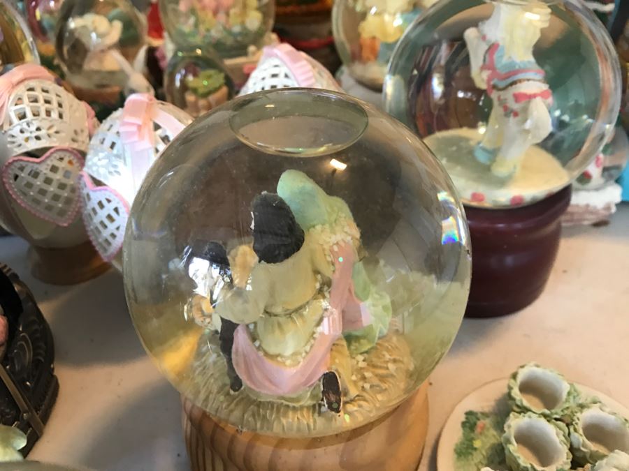 Huge Snow Globe Collection Mainly Holiday Themed Plus Decorations Featured On Table [Photo 13]