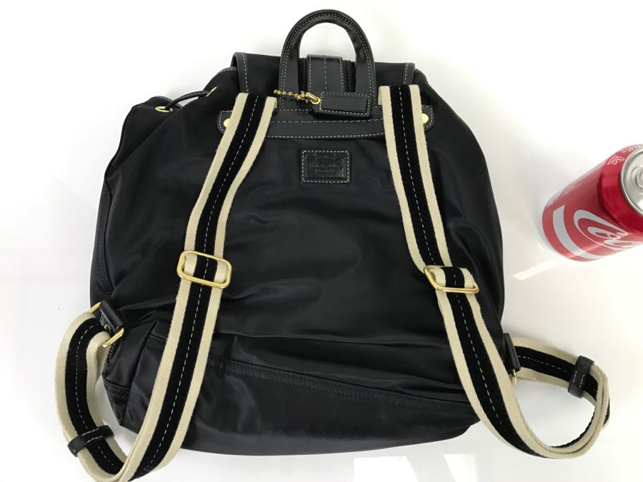 red and black coach backpack